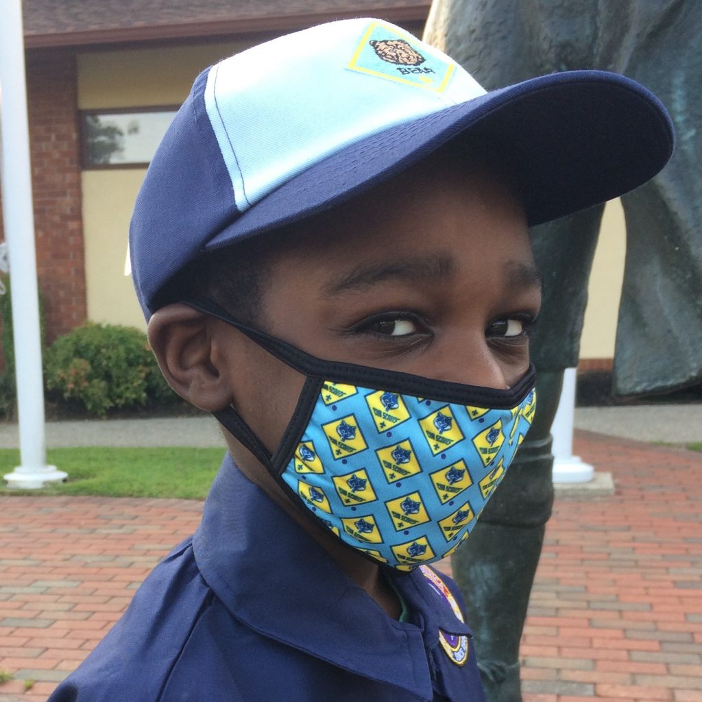 Cub Scout models face mask with Cub logo