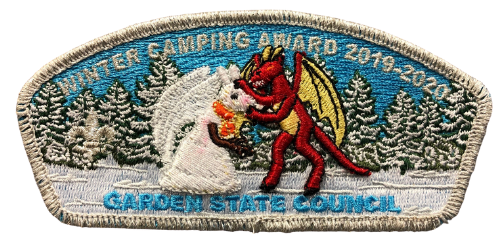 Garden State Council Winter Camper Award Council shoulder patch for 2020 features the Jersey Devil making a snowman of himself with snowy pine trees in the background