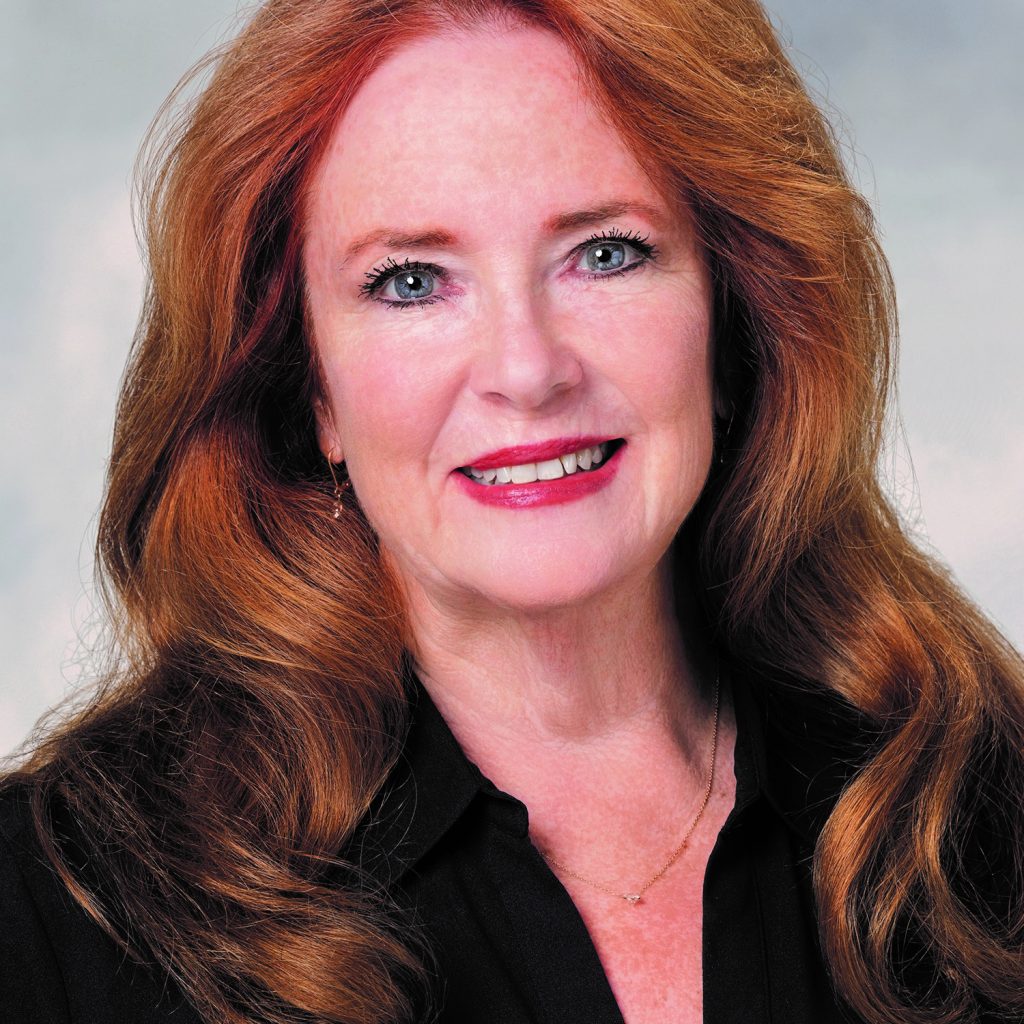 Betty Maul smiling with long, red hair