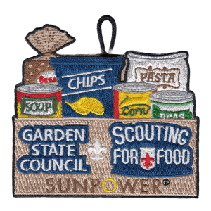 Patch showing a brown box bolding an assortment of food items typically donated to food pantries. Text on the box says "Garden State Council,," "Scouting for Food," and "SunPower"