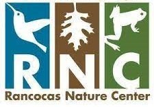 Blue, brown, and green striped logo for the Rancocas Nature Center features a bird, leave, and frog plus the letters R, N, C using white negative space.